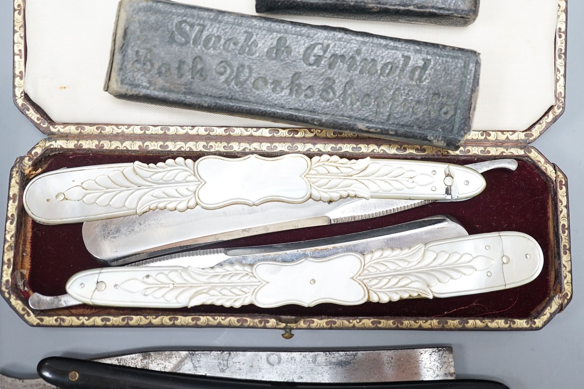 A leather cased pair of mother-of-pearl handled cut throat razors, by J Crawford and three other cased cut throat razors (4)